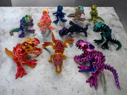 3D Druck T-Rex Rudel Skelette beweglich auf Betonplatte in vielen Farben